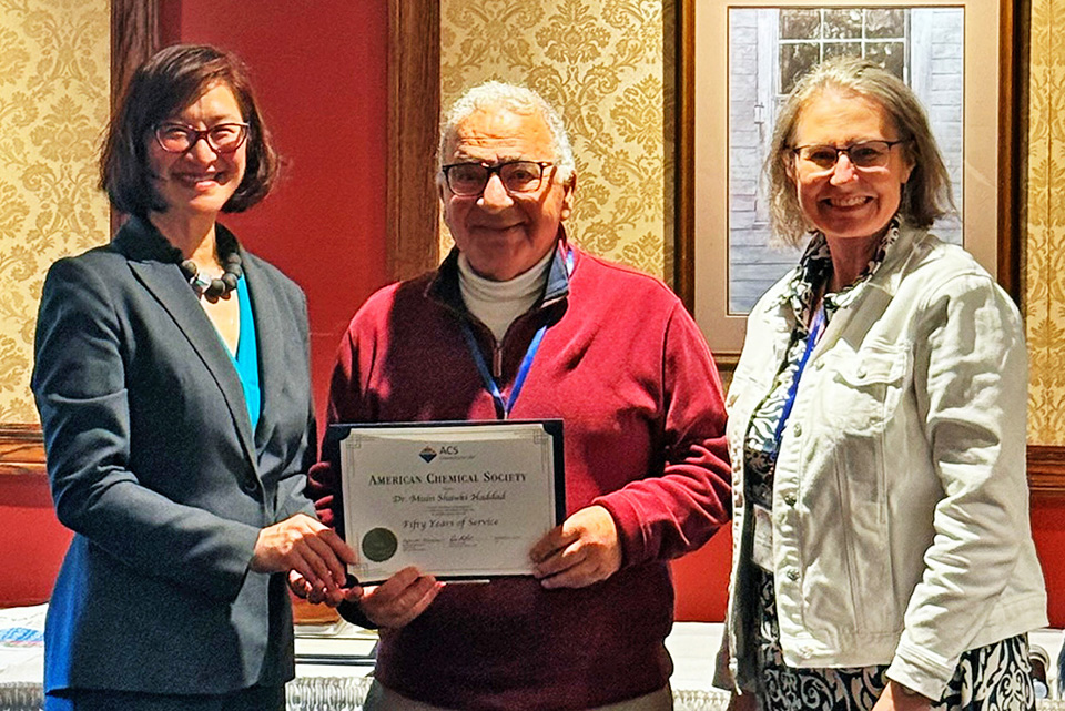 Katherine Lee (L) handing certificate to 50-year ACS member Muin Shawki Haddad (center), with Amy Balija (R)