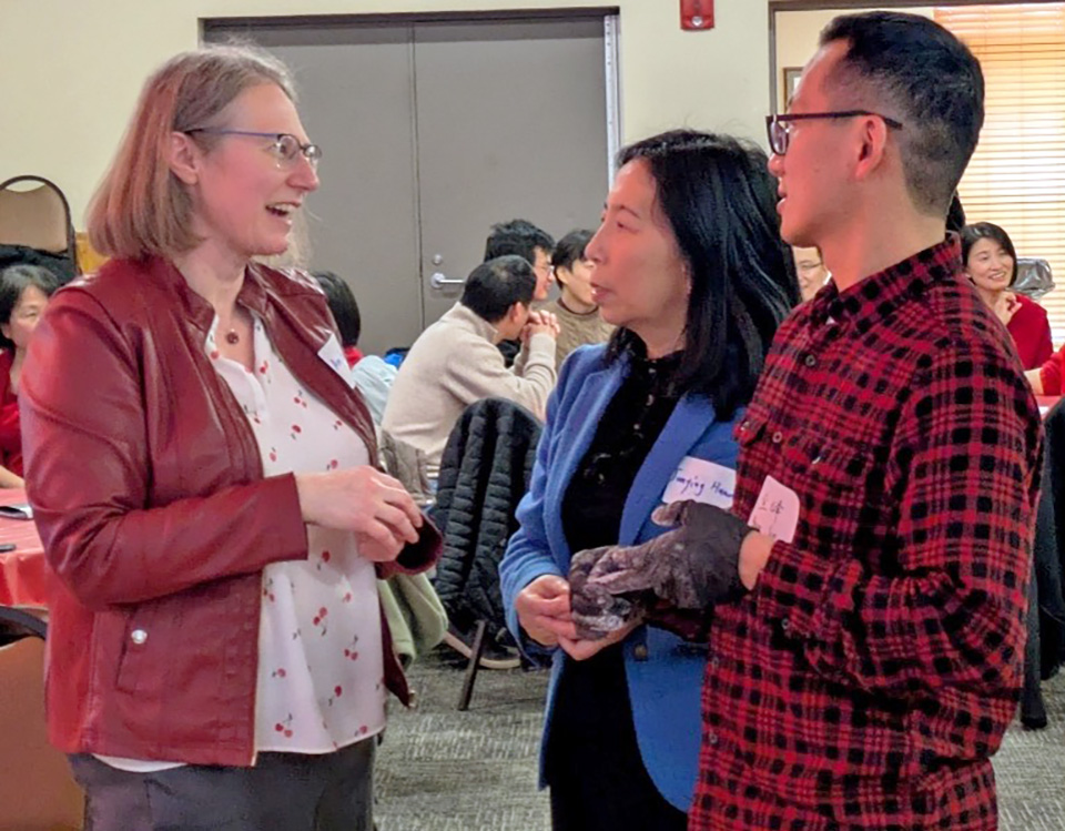 Photo taken at the Chinese American Chemical Society - Chicago ACS event for Chinese NewYear 2026 / Fire Horse, showing Chicago ACS Chair Amy Balija speaking with Great Lakes Chenese-Am CS members
