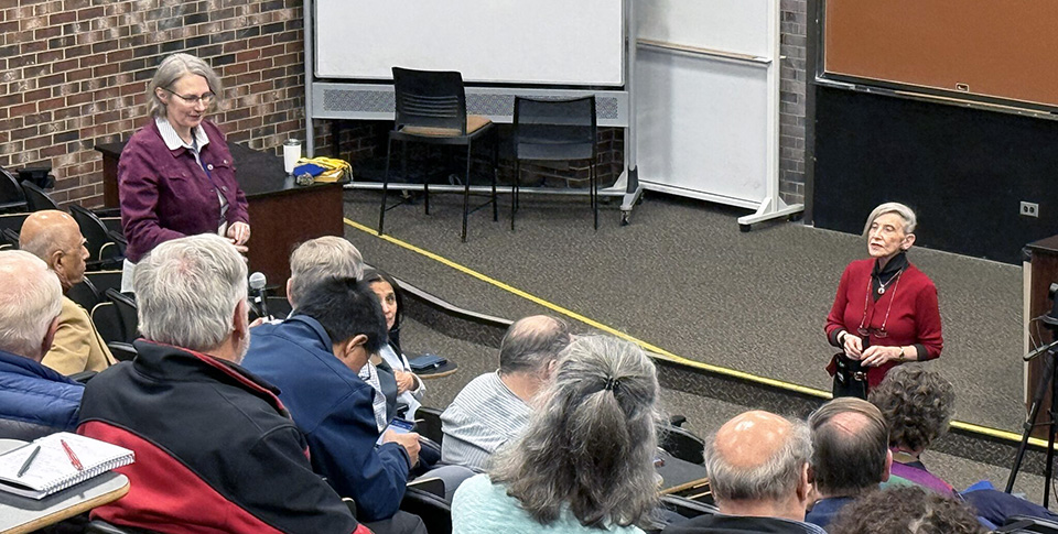 Photo of speaker Dr Judy Giordan fielding audience questions after her talk; Section Chair Amy Balija is at the left, managing questioners