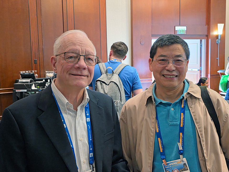 Photo from the Atlanta meeting: Russ Johnson (left) and a fellow participant at the IAC reception