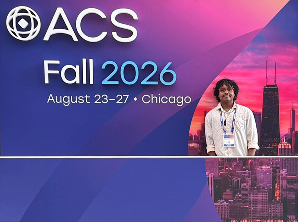 photo of Abdul Sarkar inside the ACS Fall 2026 backdrop, featuring a colorful Chicago skyline